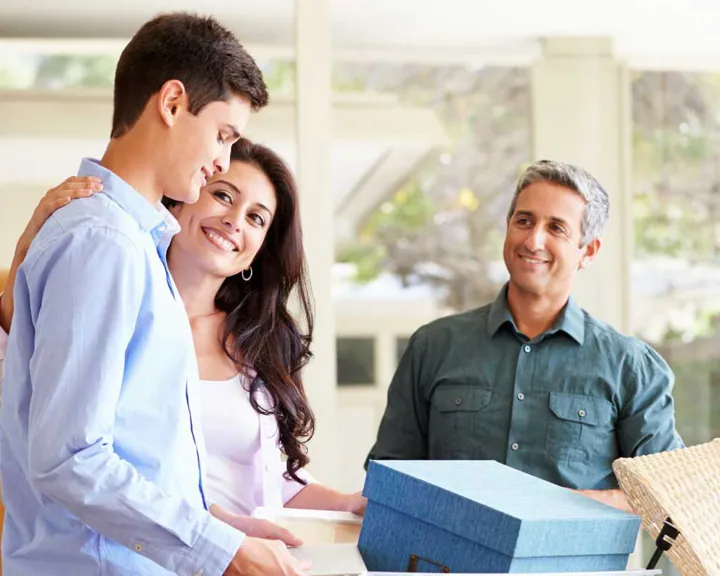 Parents helping their son move into college